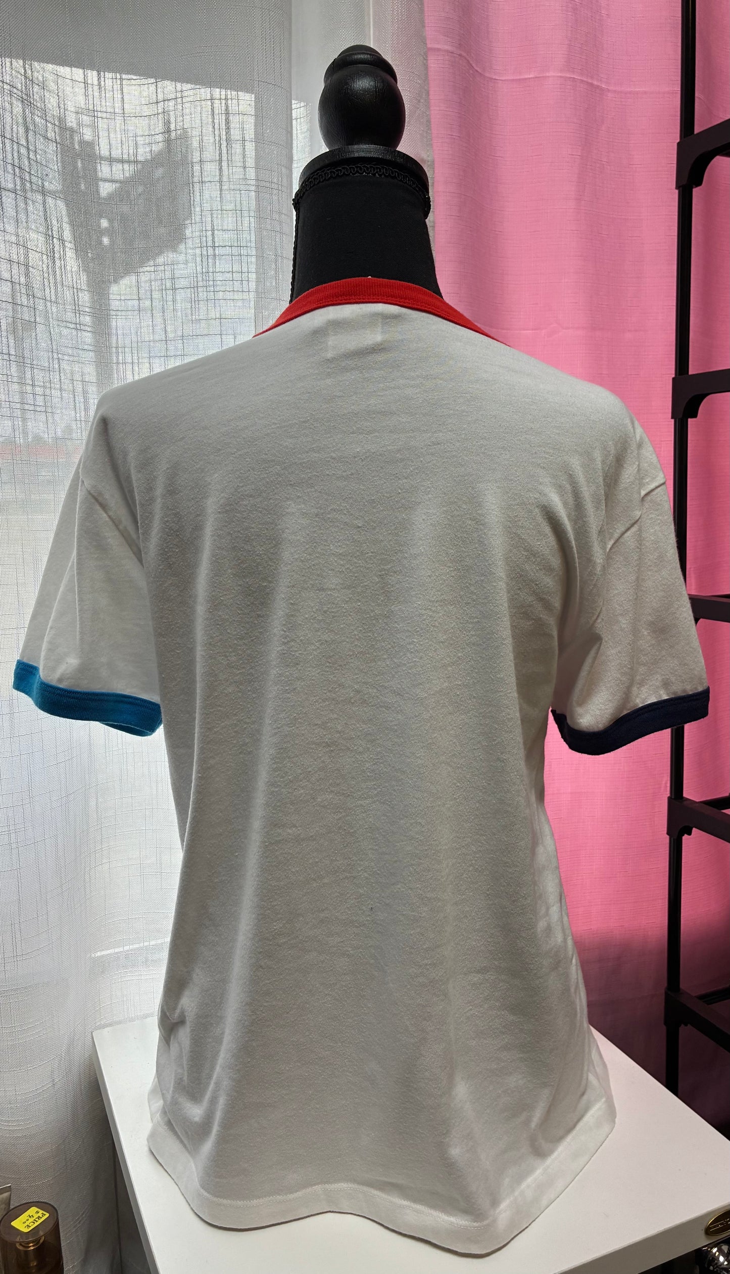 Champion Women's Campus Ringer Tee in white with a red and blue script logo-Size Medium